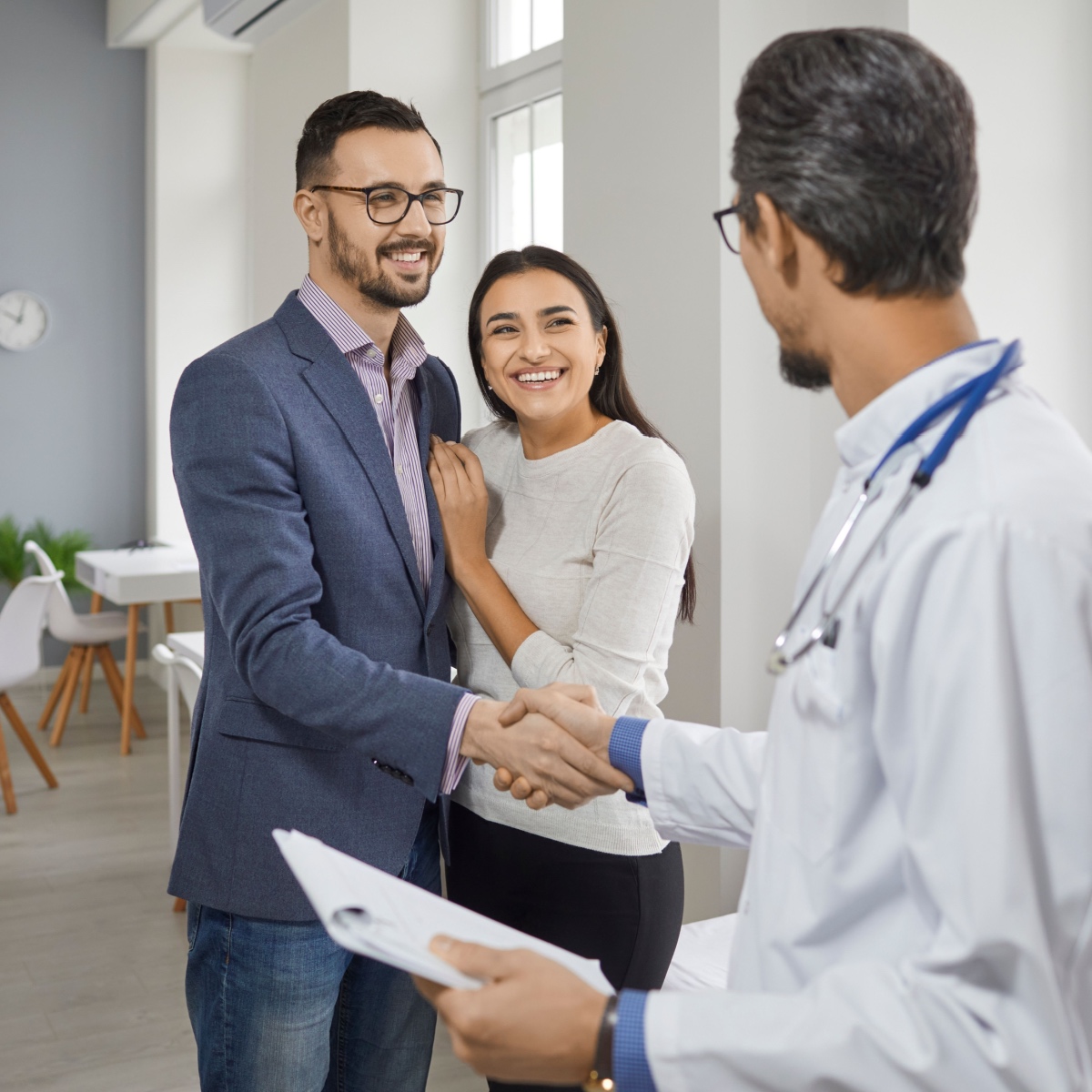 A couple talking to an IVF doctor